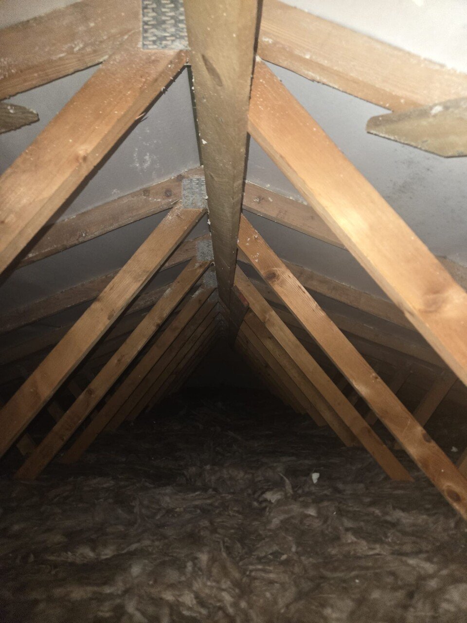 Loft roof timbers and insulation after spray foam removal, Ascot