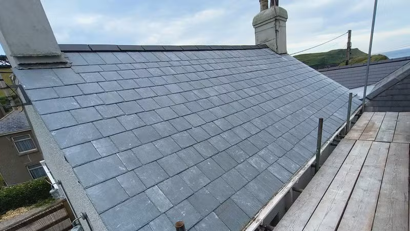 Slate roof replacement & foam removal — 23m²