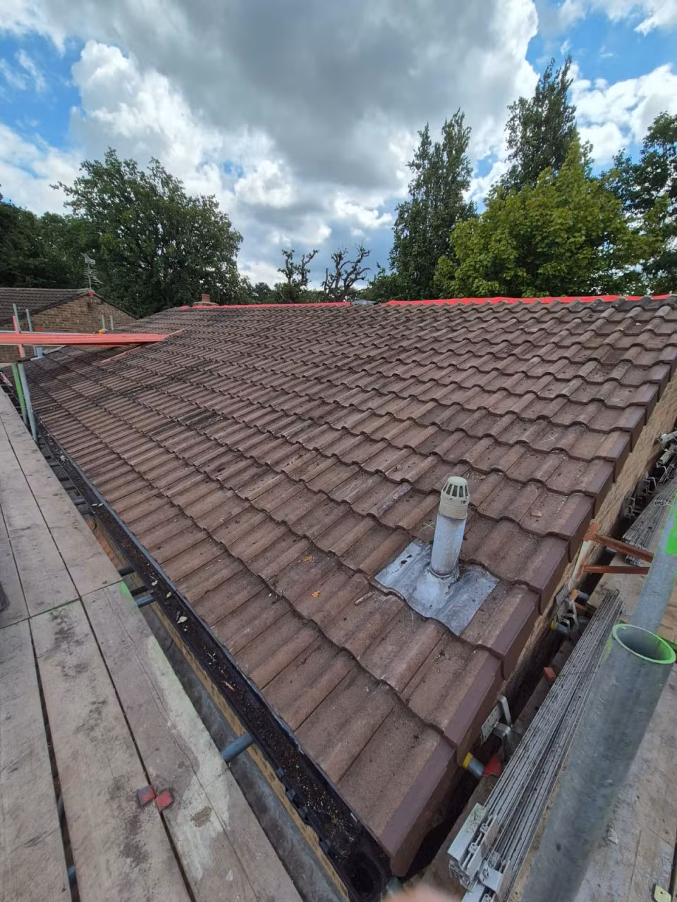 Concrete tiled roof after closed-cell spray foam removal and roof replacement