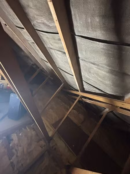 Roof timbers and membrane inside the loft after spray foam removal