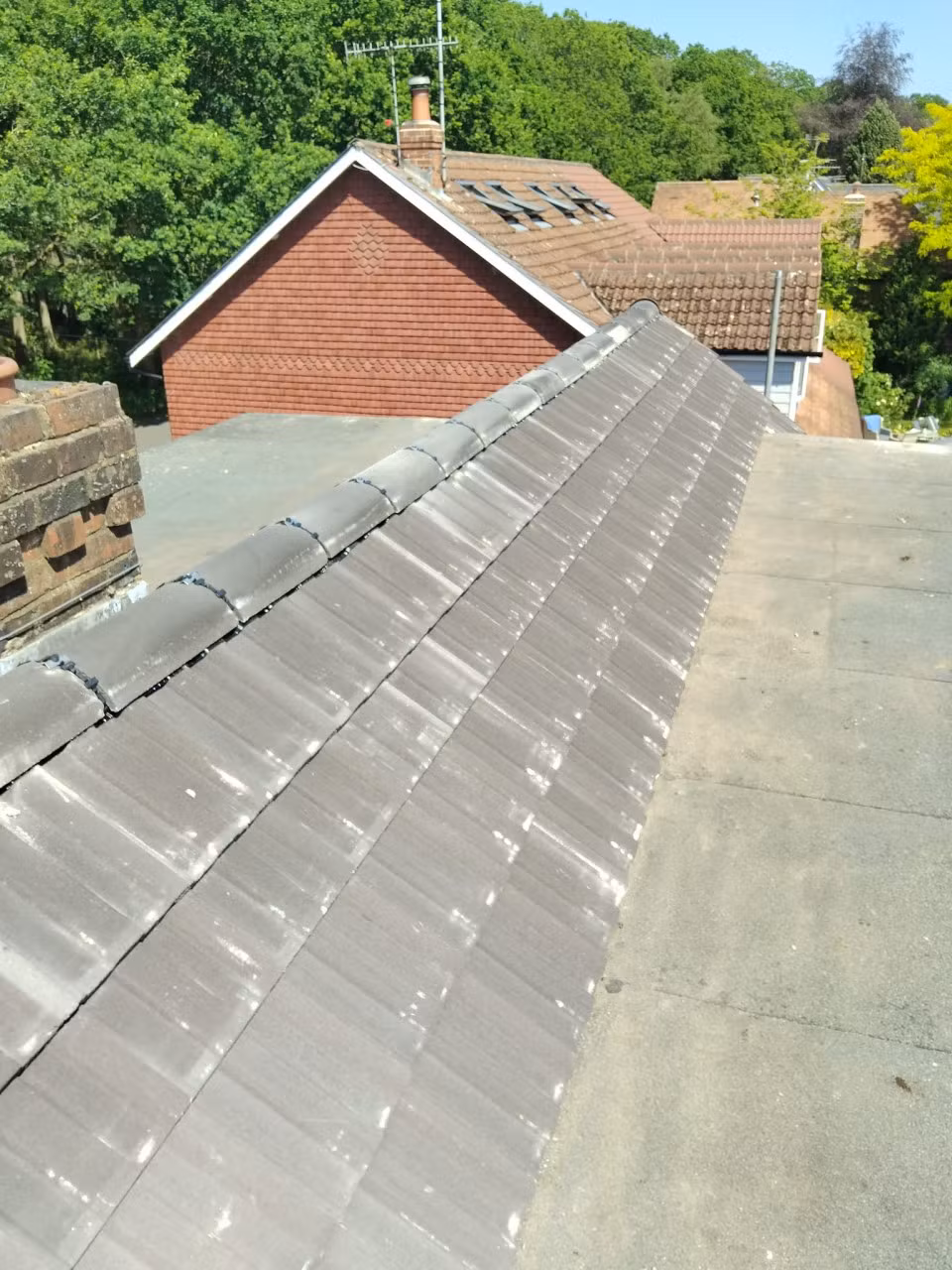 Completed roof with new tiles and ridge